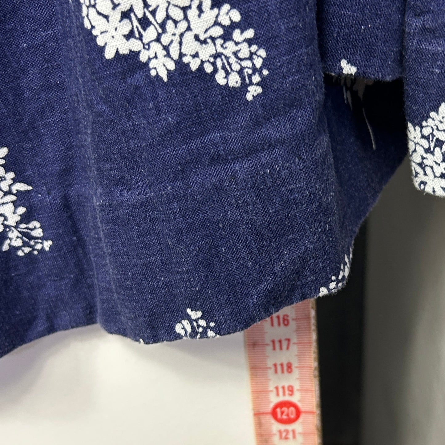 Navy blue top with white floral graphic front view