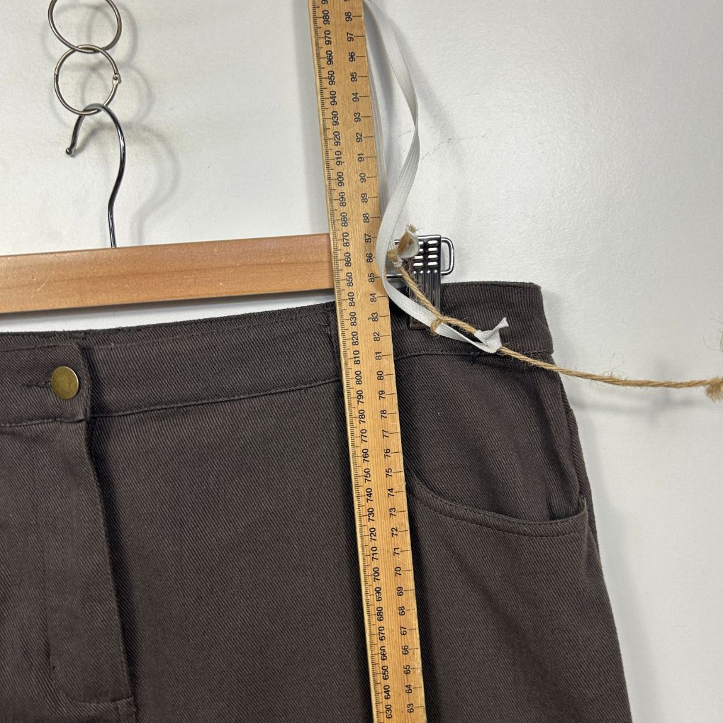 Dark grey pants front view with measuring tape