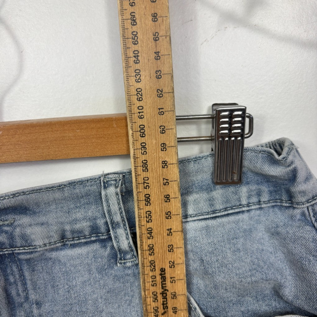 Blue denim jeans waistband detail view with measuring tape