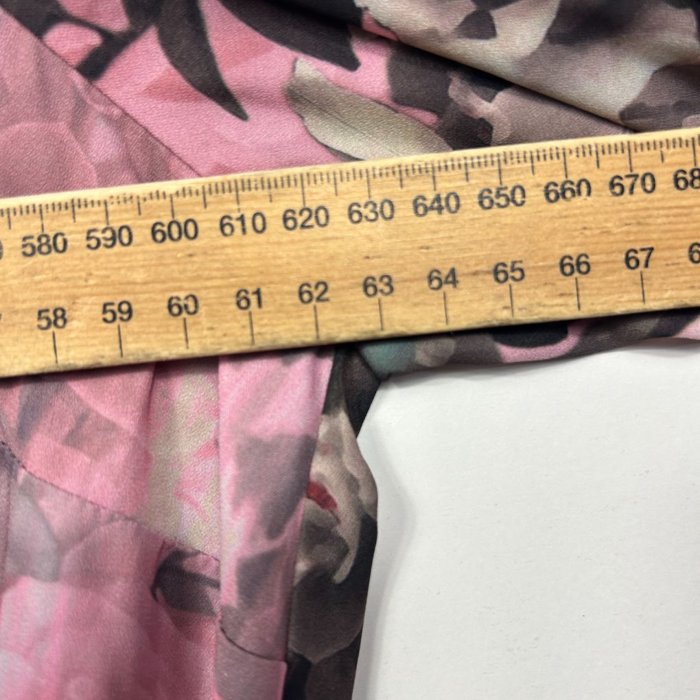 Pink and grey graphic fabric with measuring tape detail view