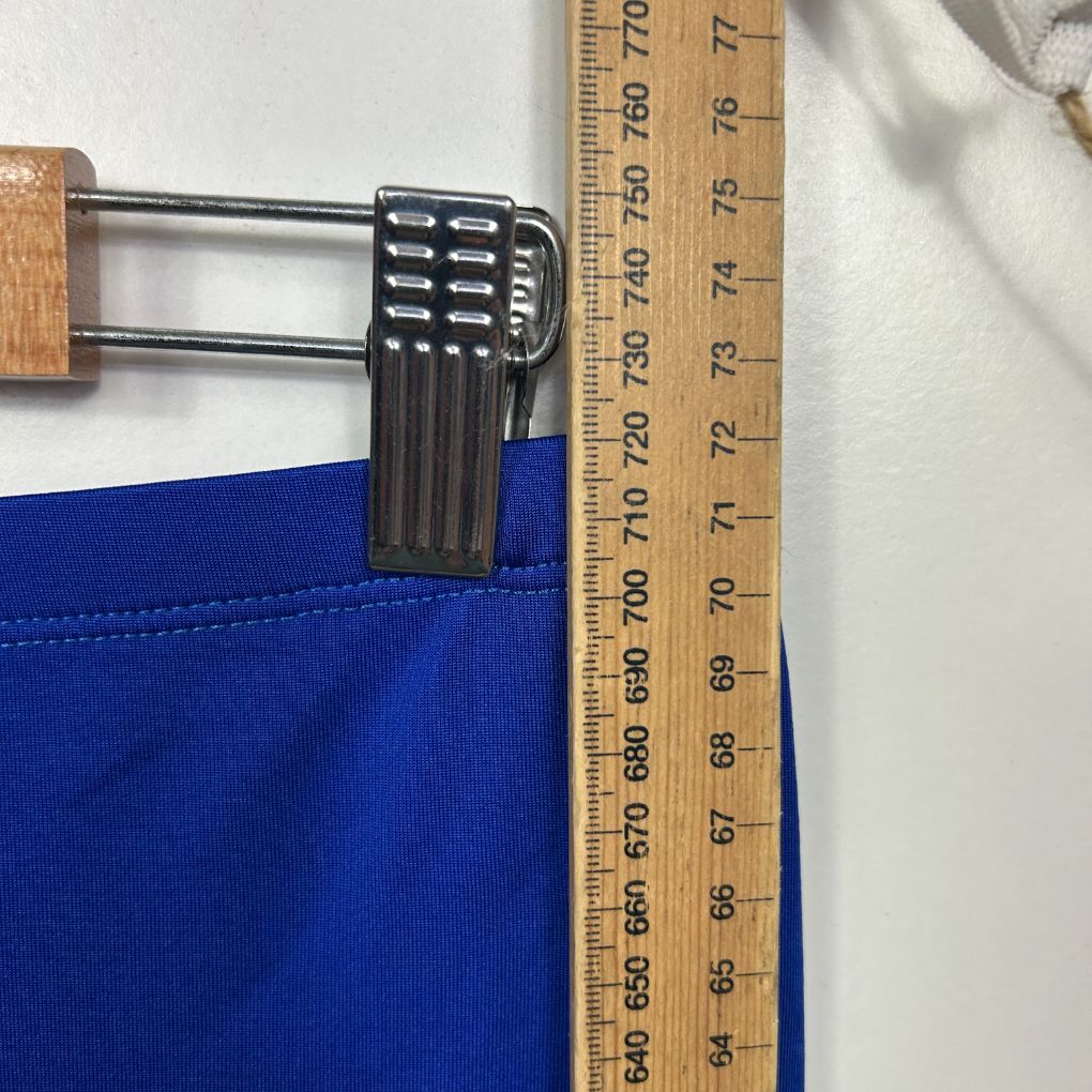 Blue fabric detail view with measuring tape