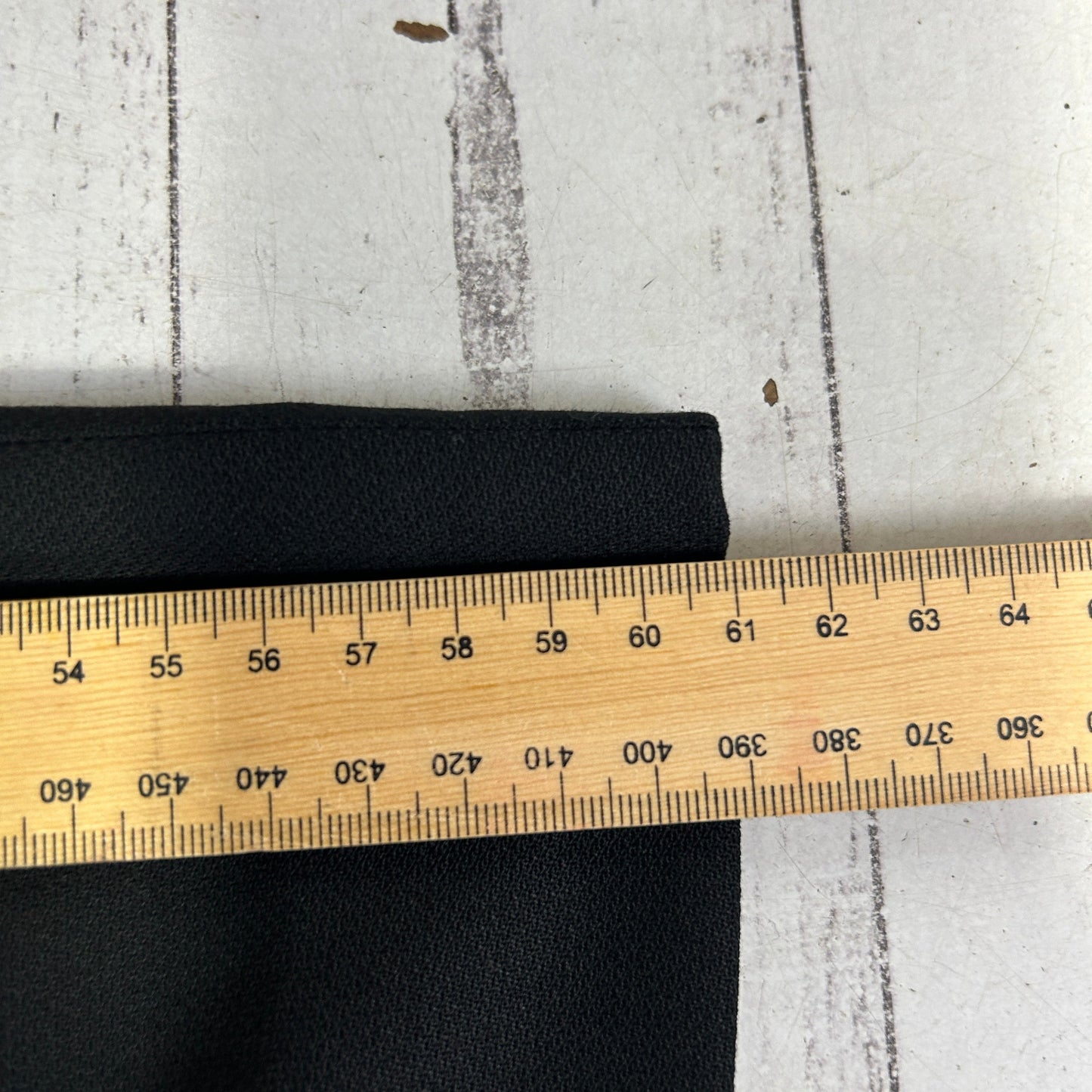 Black elastic band detail view with measuring tape