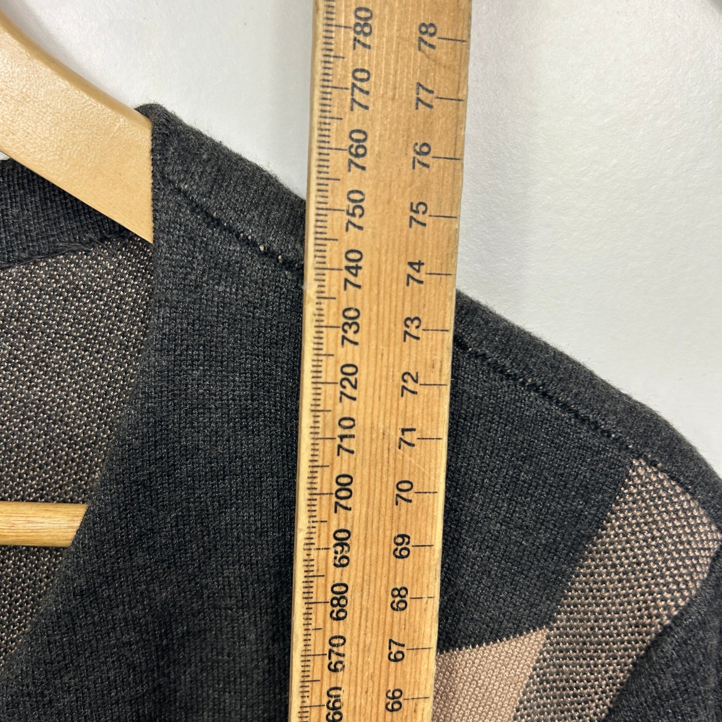 Black mesh top detail view with measuring tape