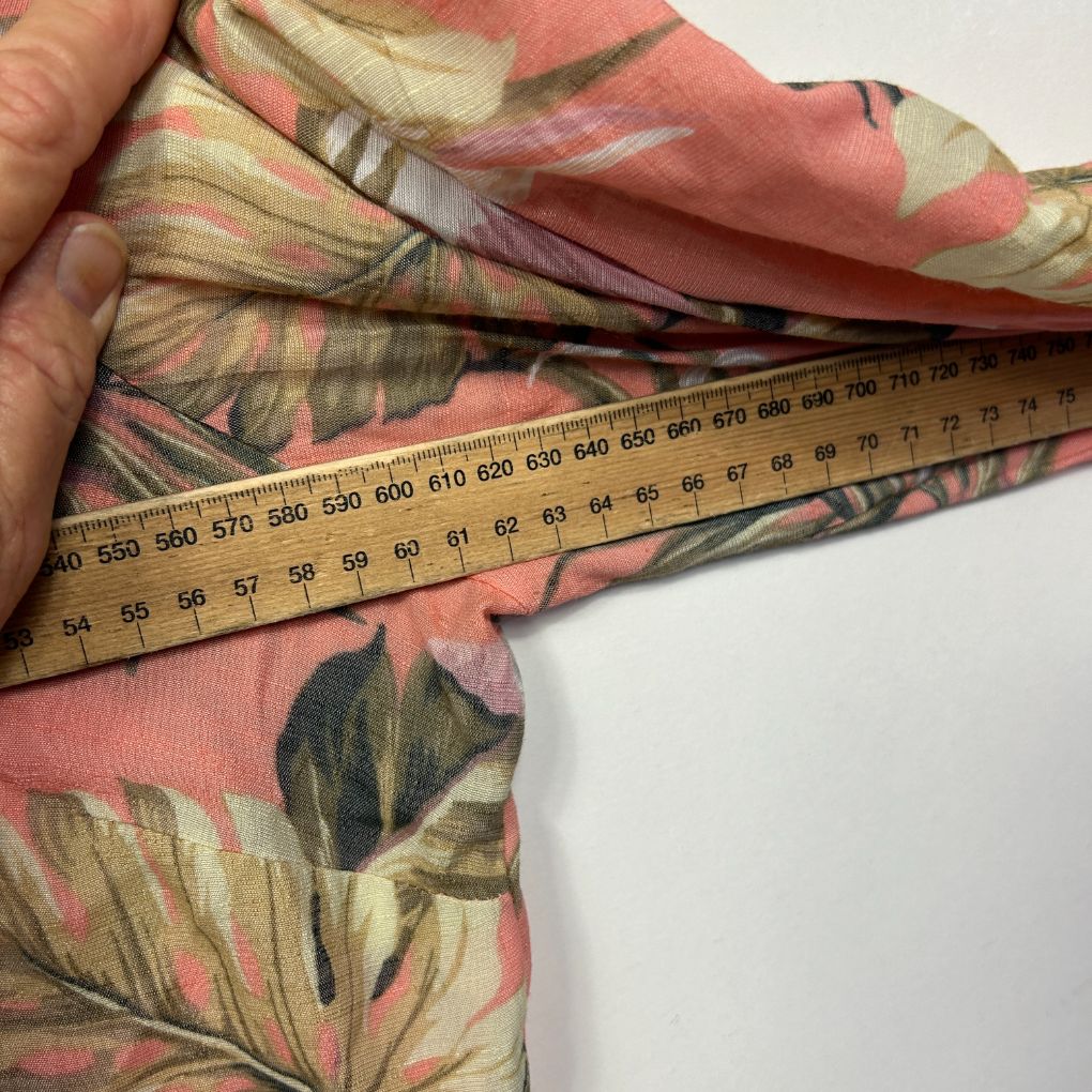 Pink floral scarf detail view with ruler measurement