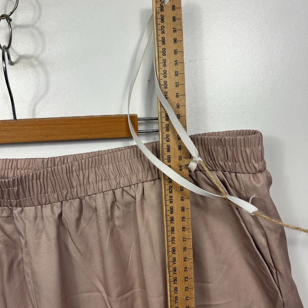 Beige pants with elastic waistband detail view