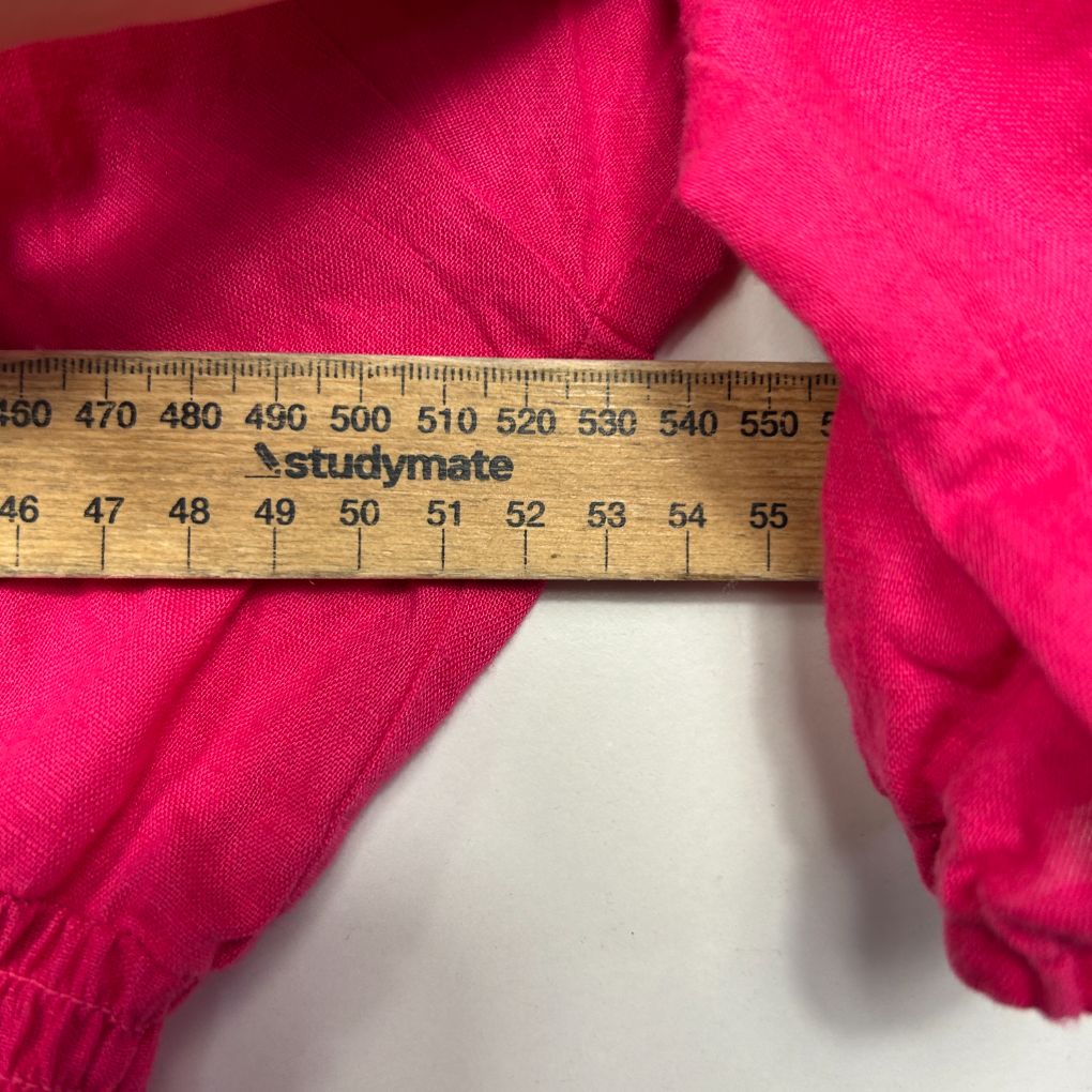 Pink garment size measurement detail view