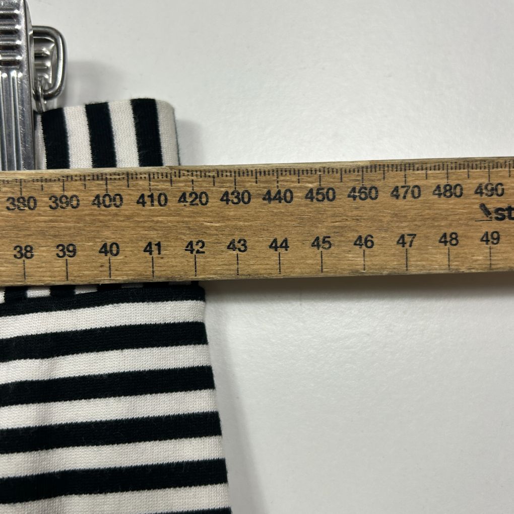 Black and white striped fabric detail view with measuring ruler