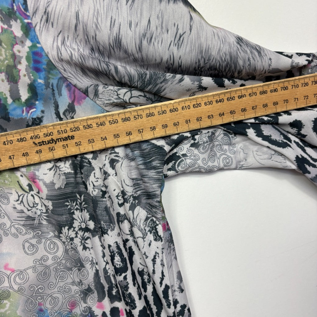 Black and white patterned top detail view with measuring tape