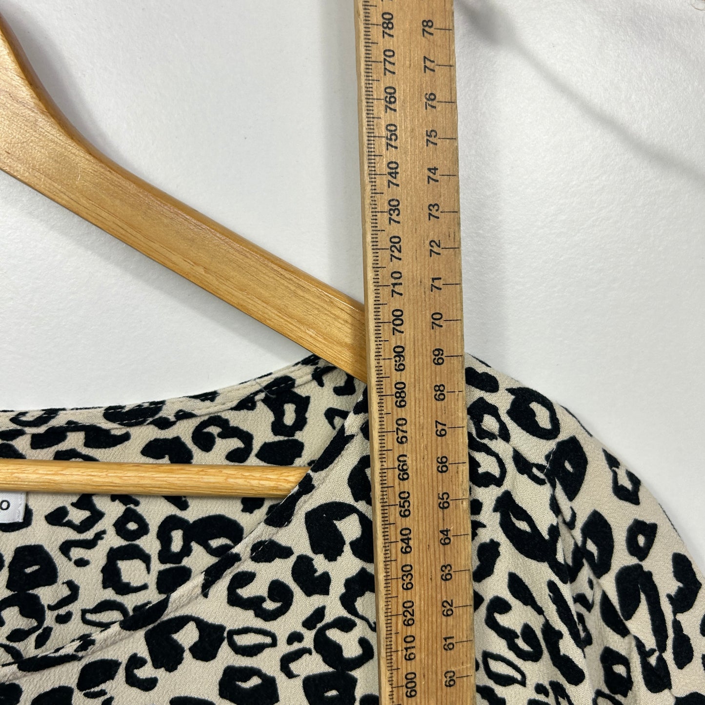 Cream and black leopard print long sleeve top detail view