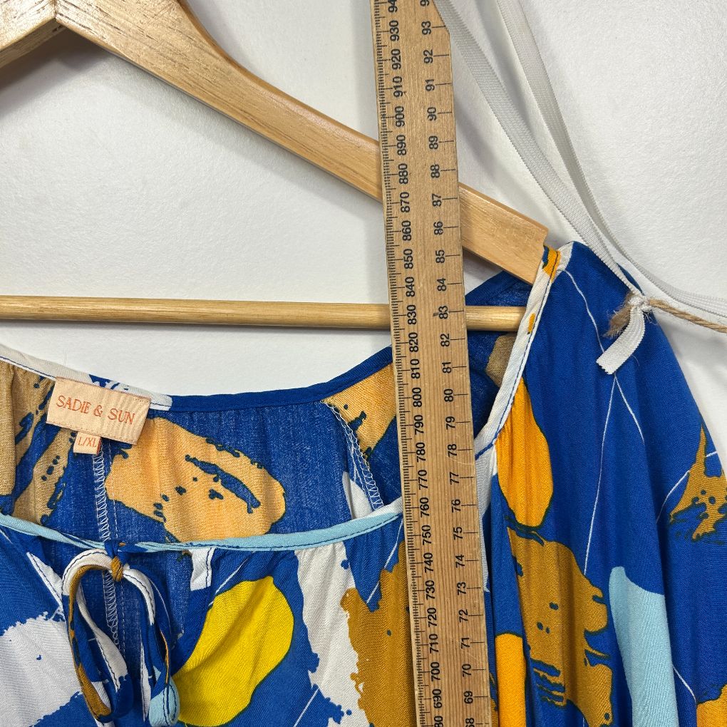 Blue dress with yellow and white graphic print detail view
