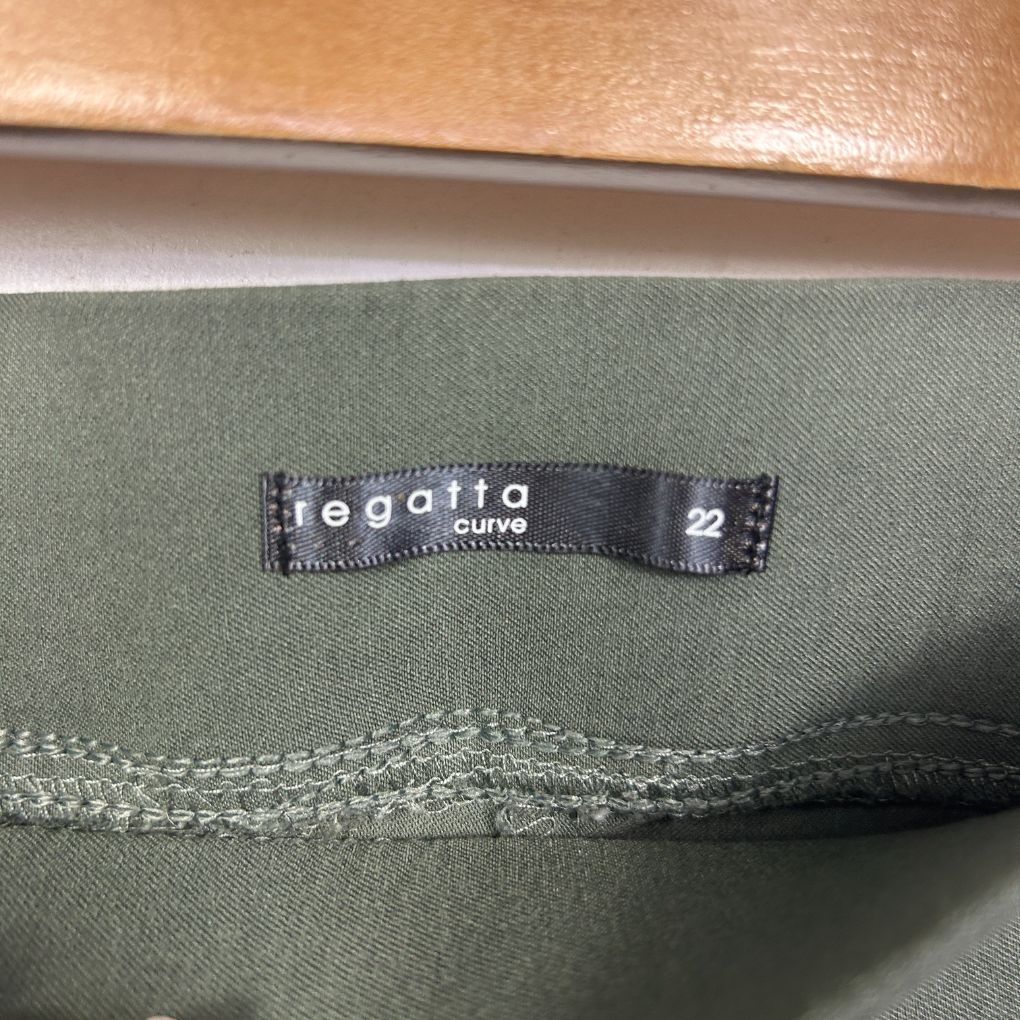 Sage green garment label detail view