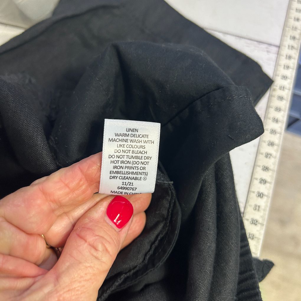 Black garment care label detail view