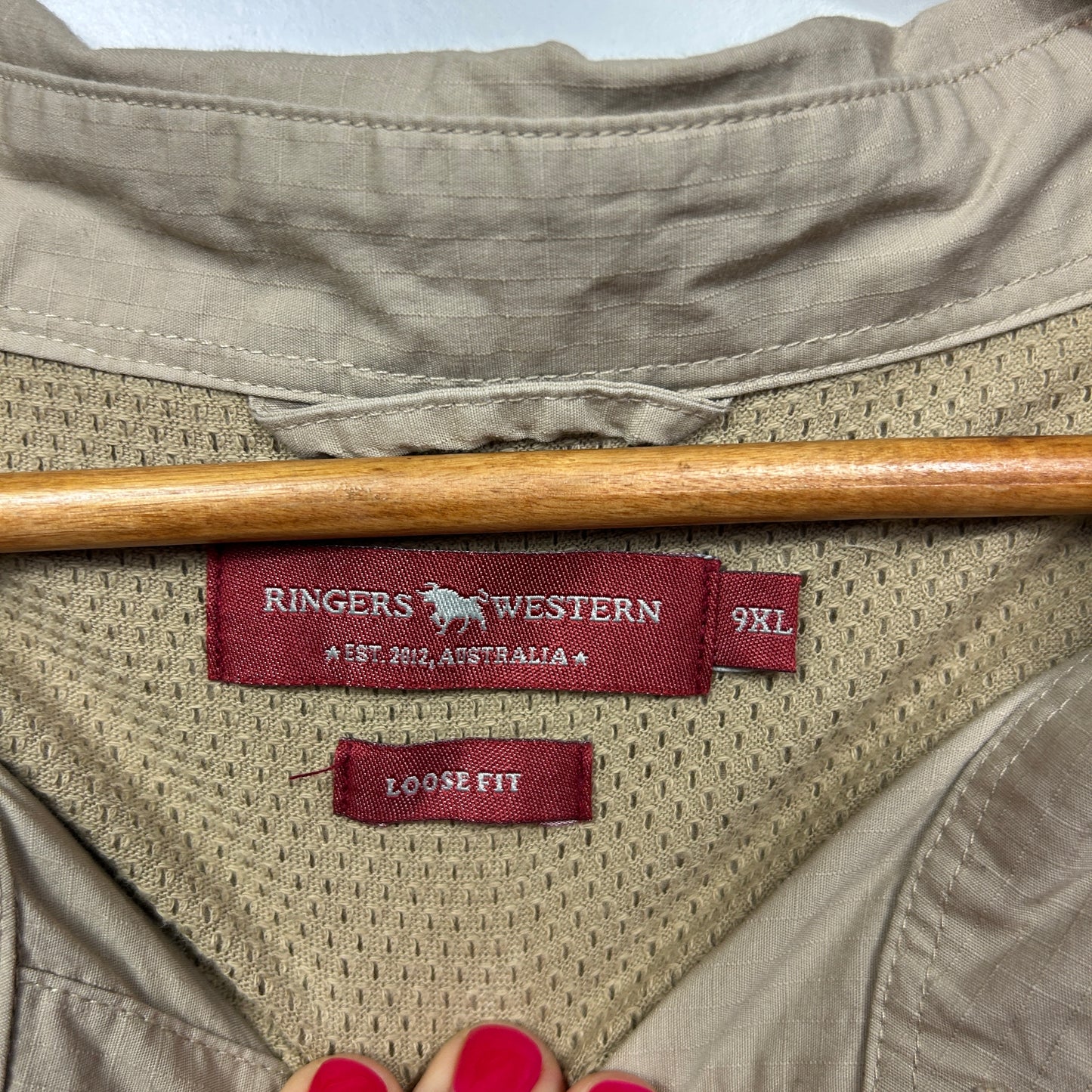 Cream mesh shirt label detail view