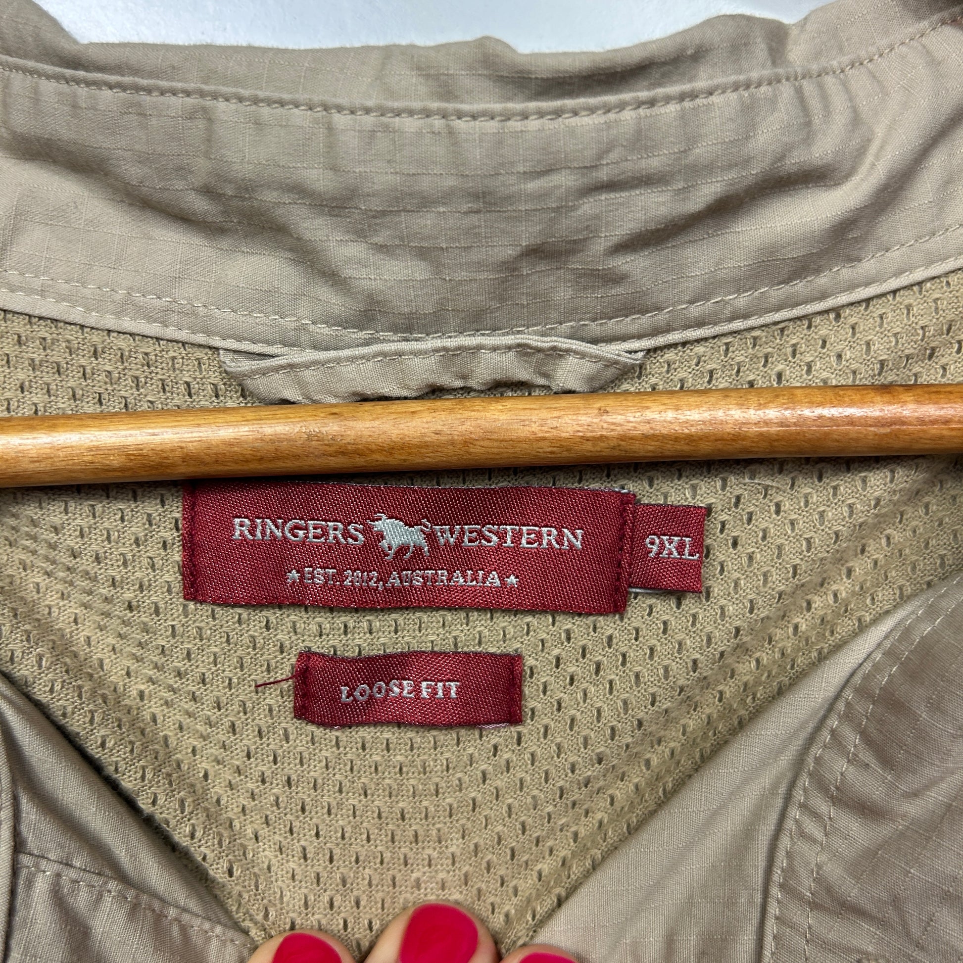 Cream mesh shirt label detail view