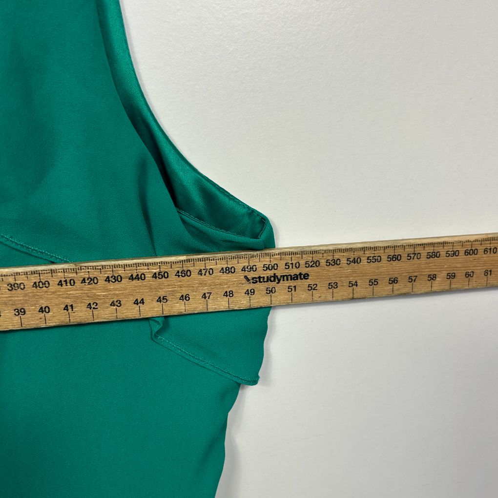 Teal fabric with measuring tape detail view