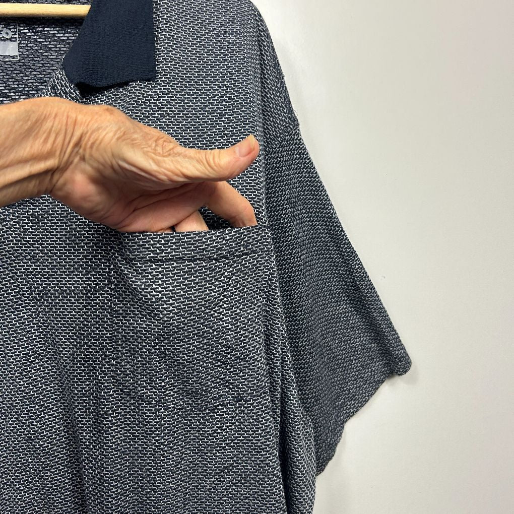 Grey textured cardigan front view with hand in pocket