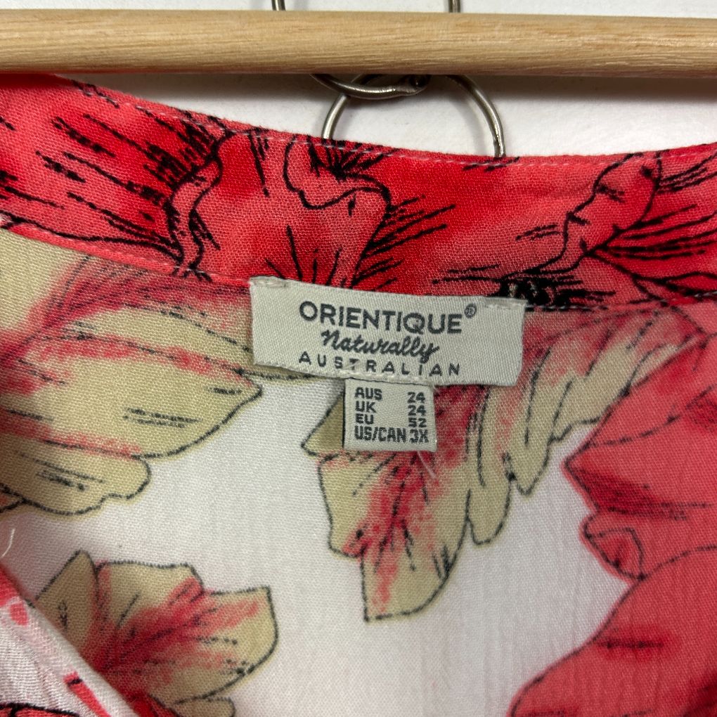 Red floral scarf detail view showing label