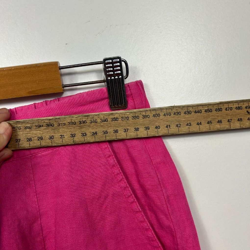Pink shorts detail view with measuring tape
