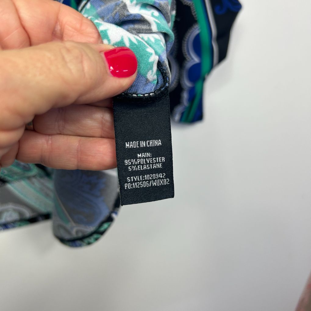 Clothing label detail view showing care instructions