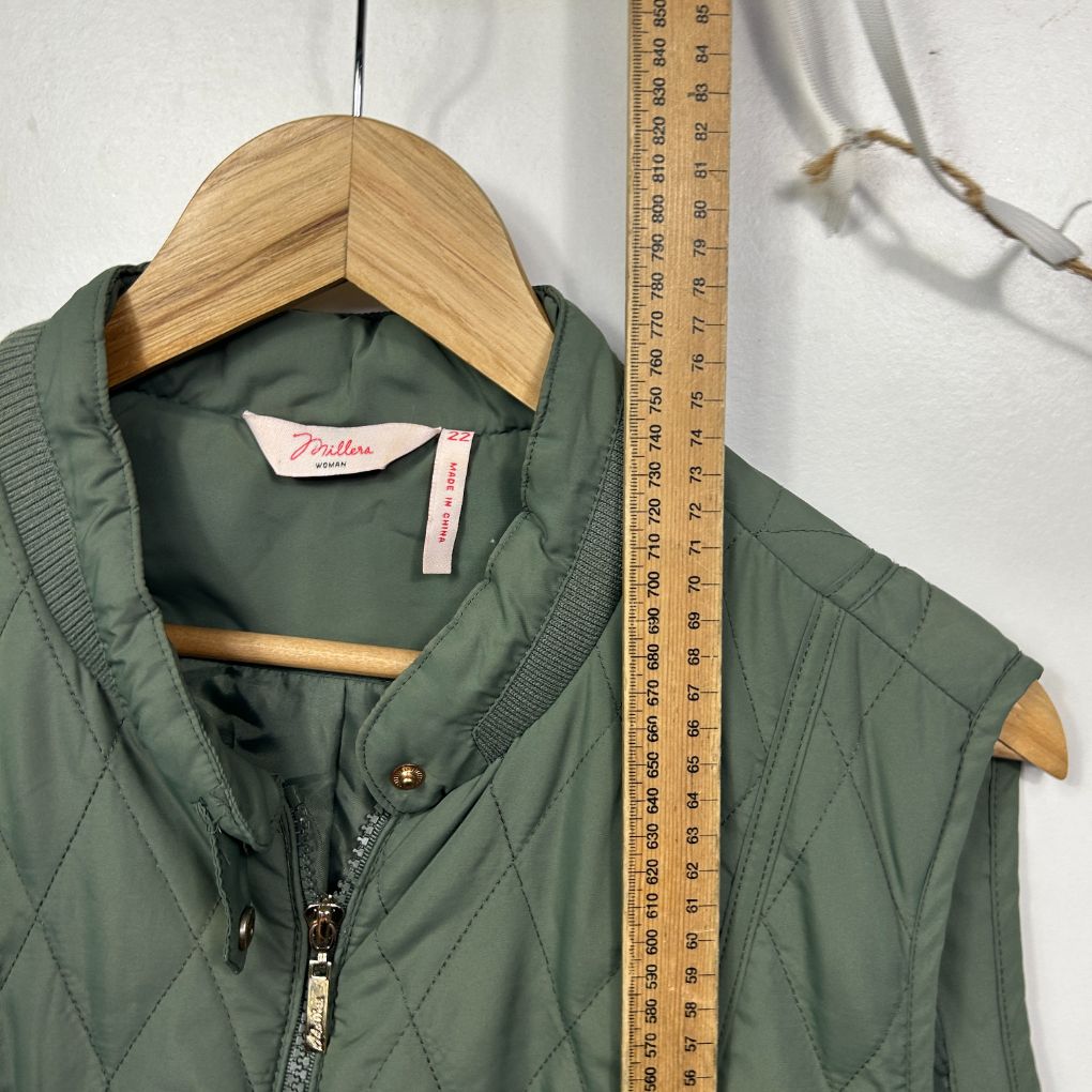 Sage green quilted vest front view