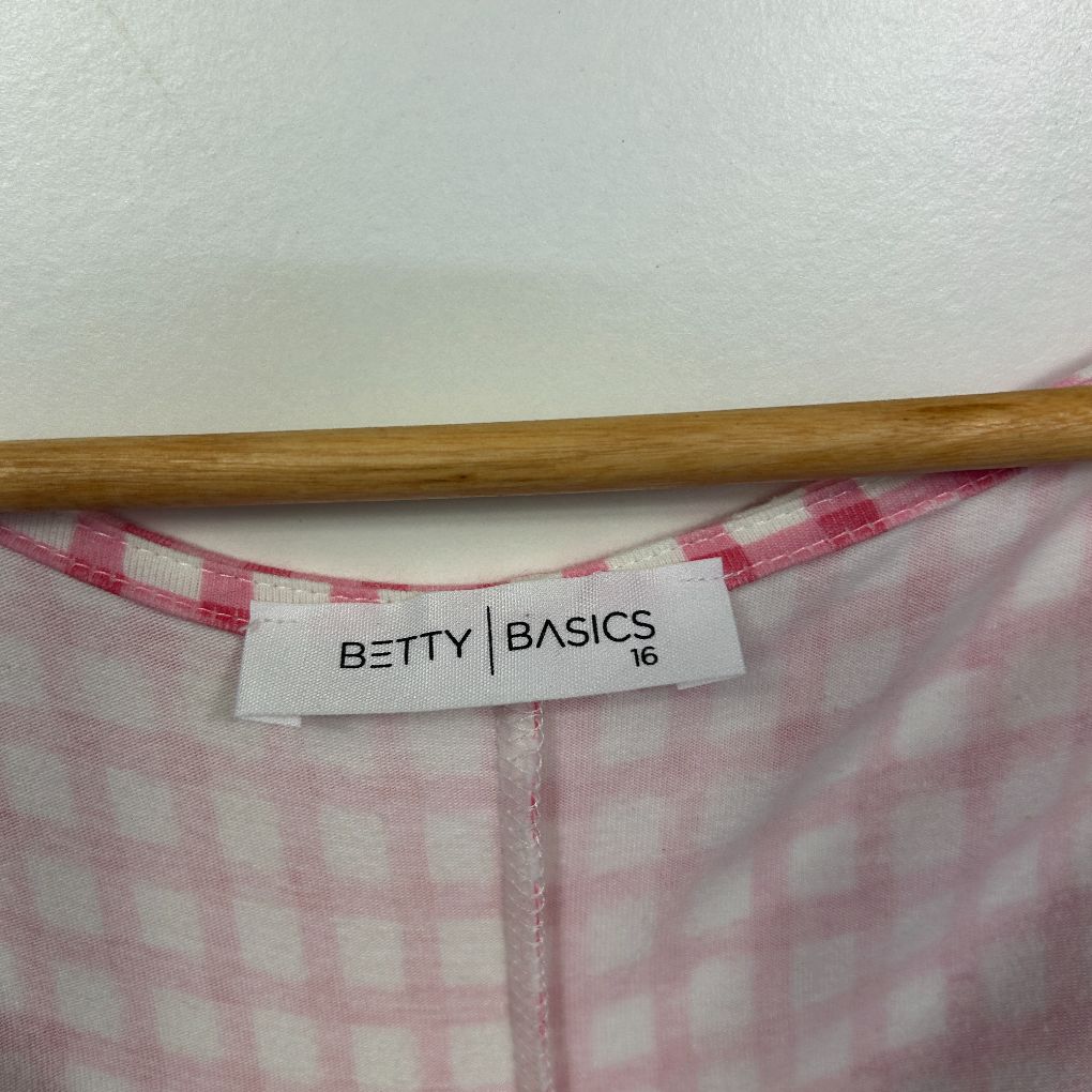 Pink and white checkered shirt label detail view