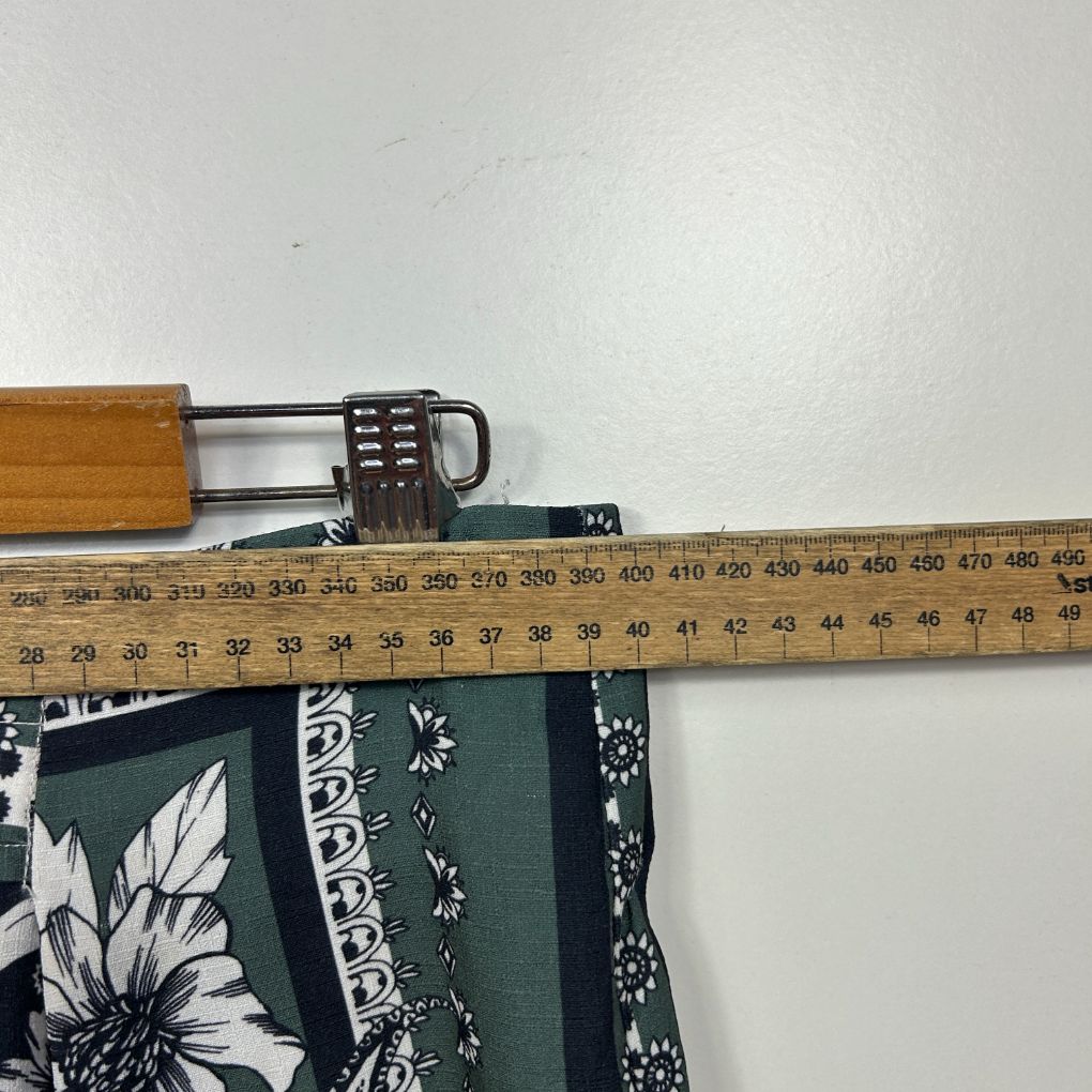 Navy floral fabric detail with measuring tape