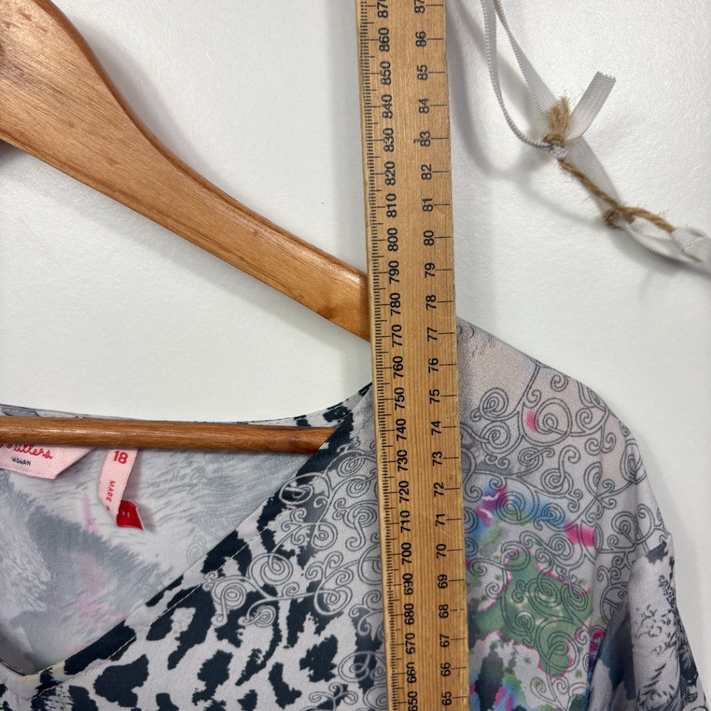 Grey patterned top front view with measuring tape