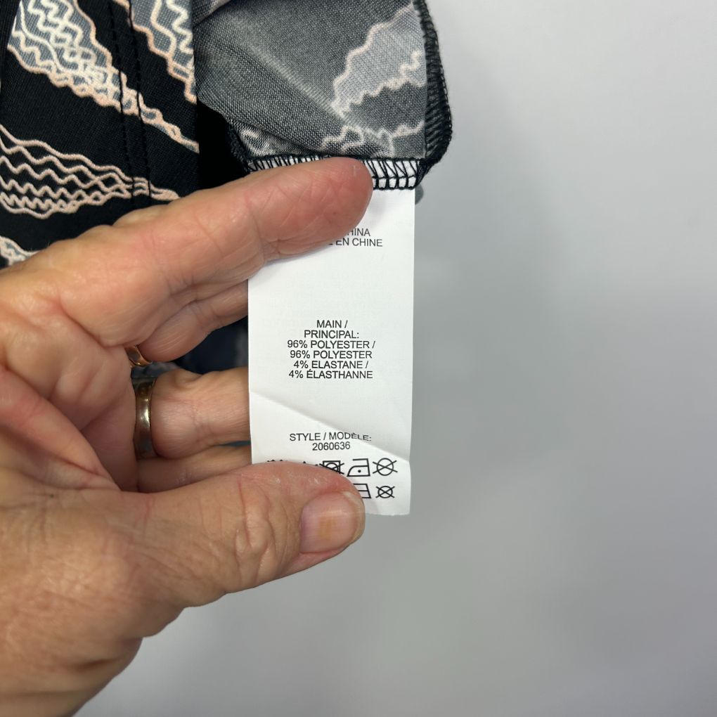 Black and white patterned fabric label detail view