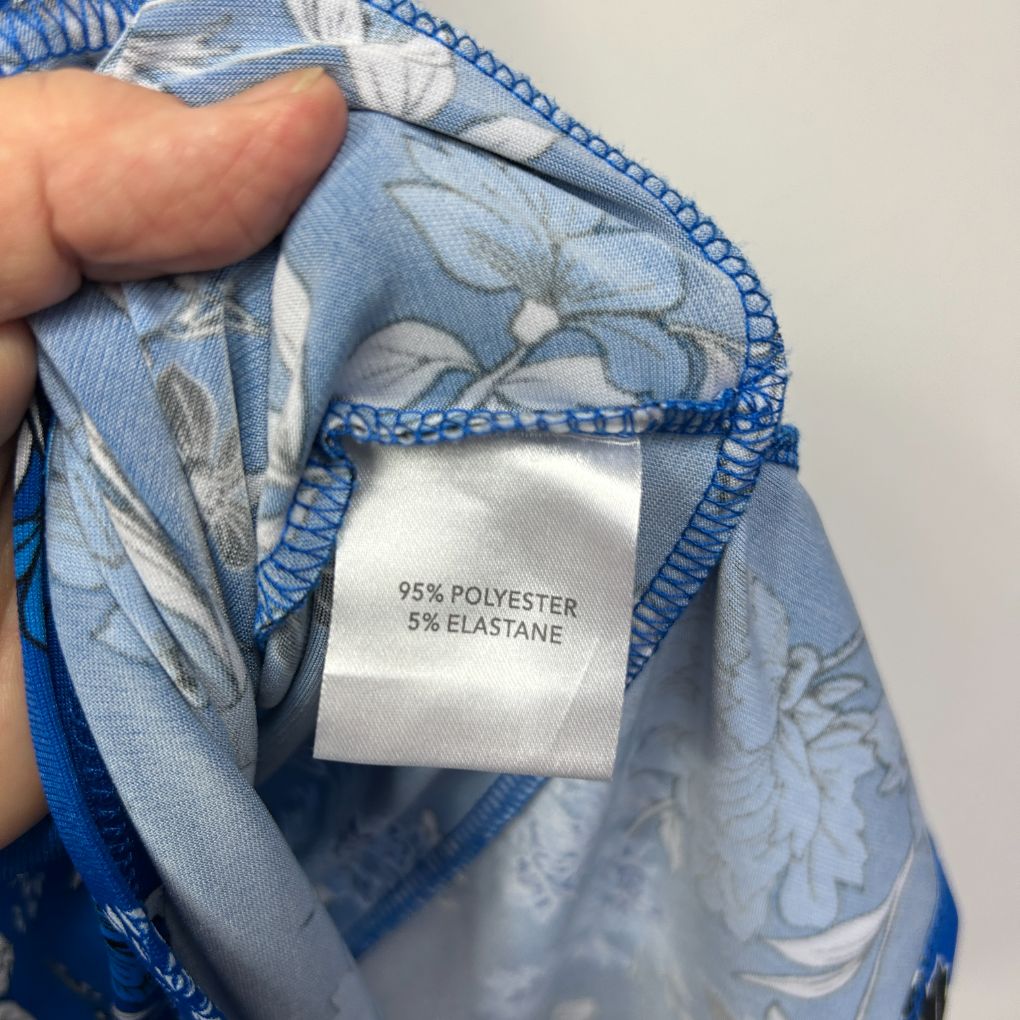 Blue floral fabric label detail view