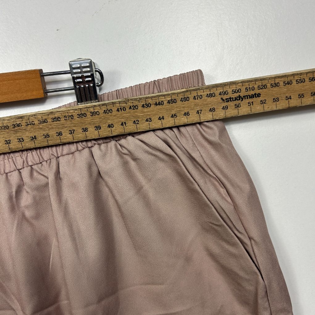 Beige elasticated shorts waistband detail view
