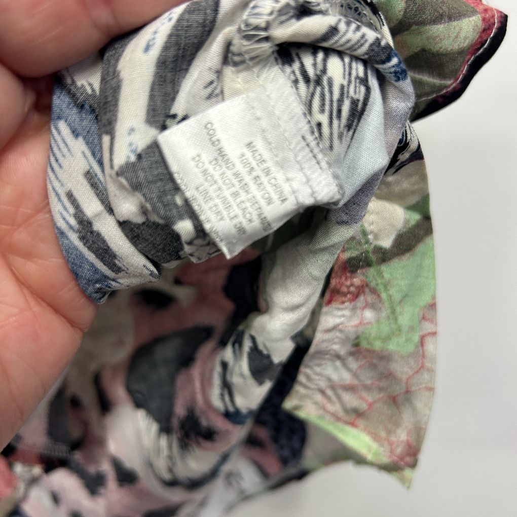 Multicolour patterned fabric detail view with label