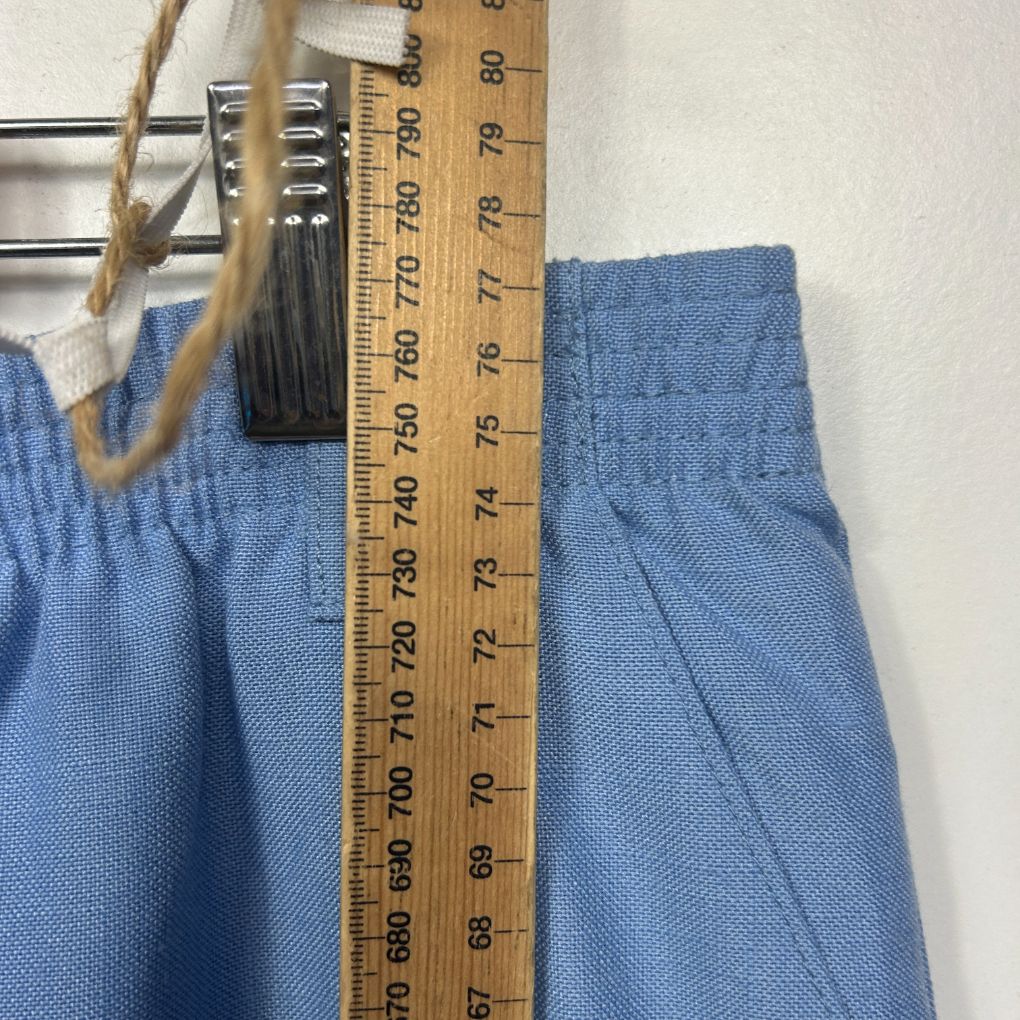 Blue shorts detail view with measuring tape