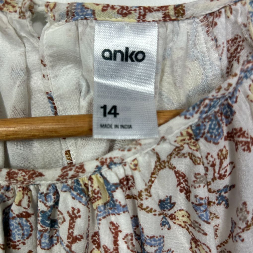 Cream floral dress label detail view