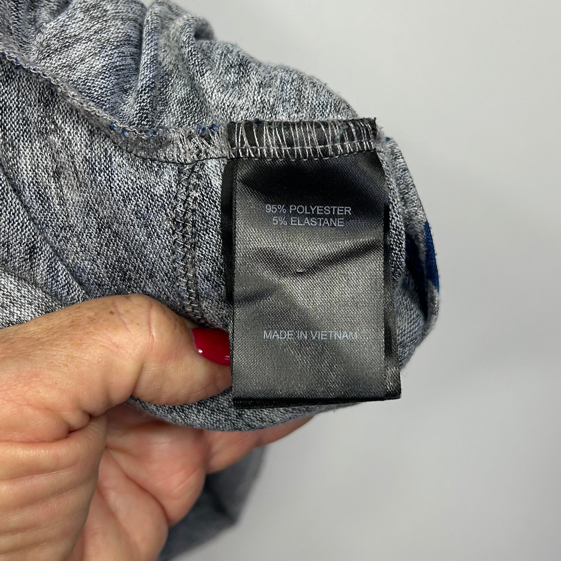 Grey and navy striped jumper label detail view