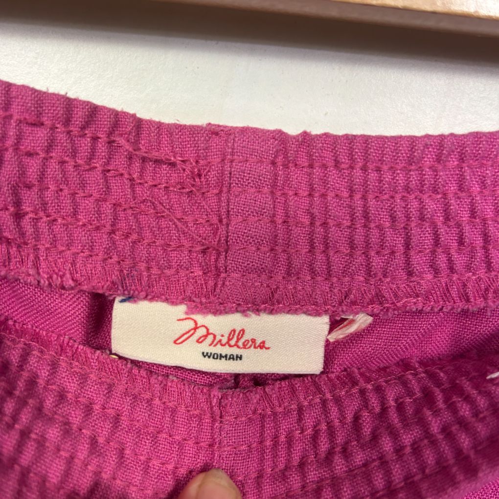 Pink knit top label detail view