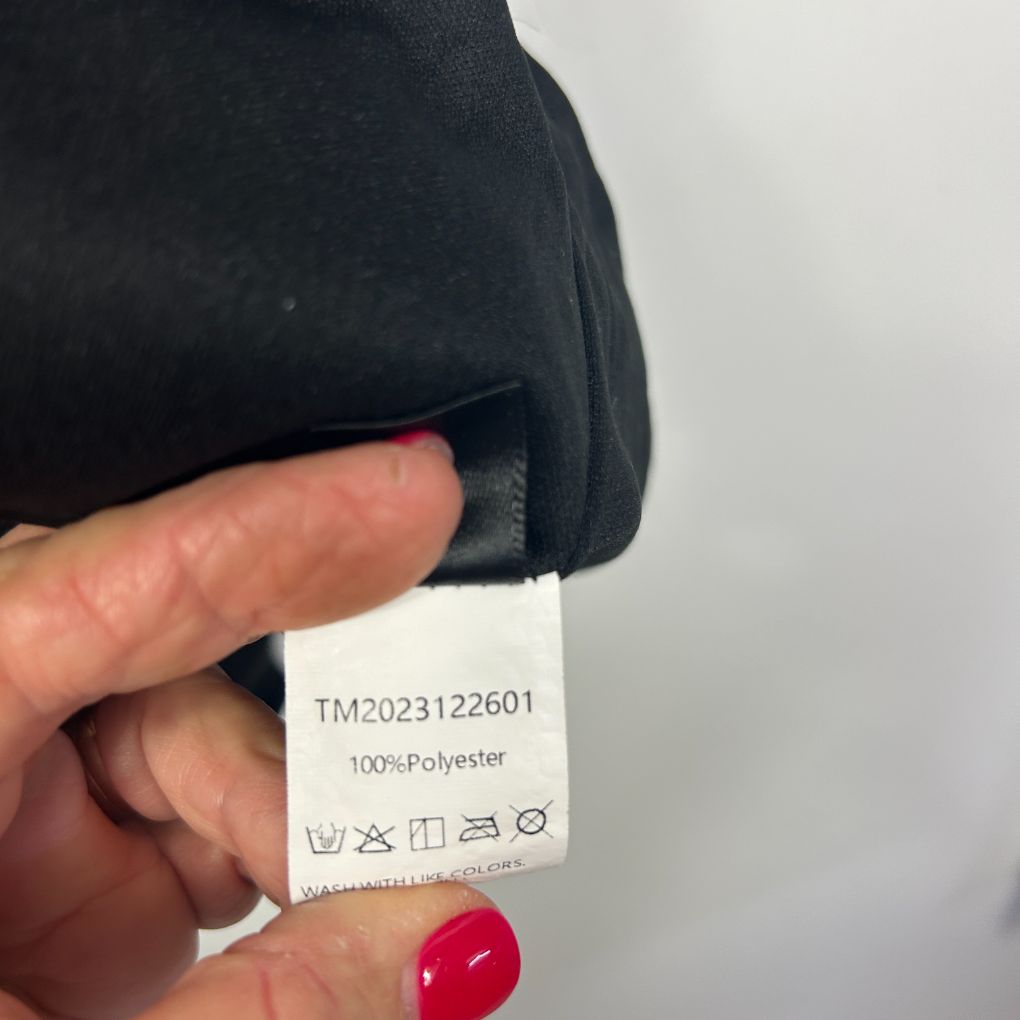 Navy polyester garment label detail view