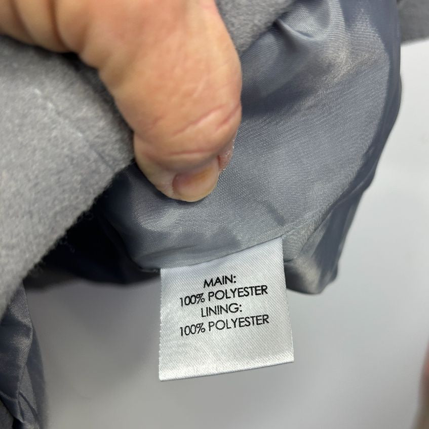 Gray polyester garment label detail view