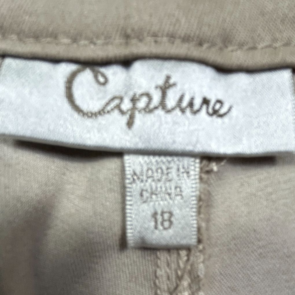 Beige garment label detail view
