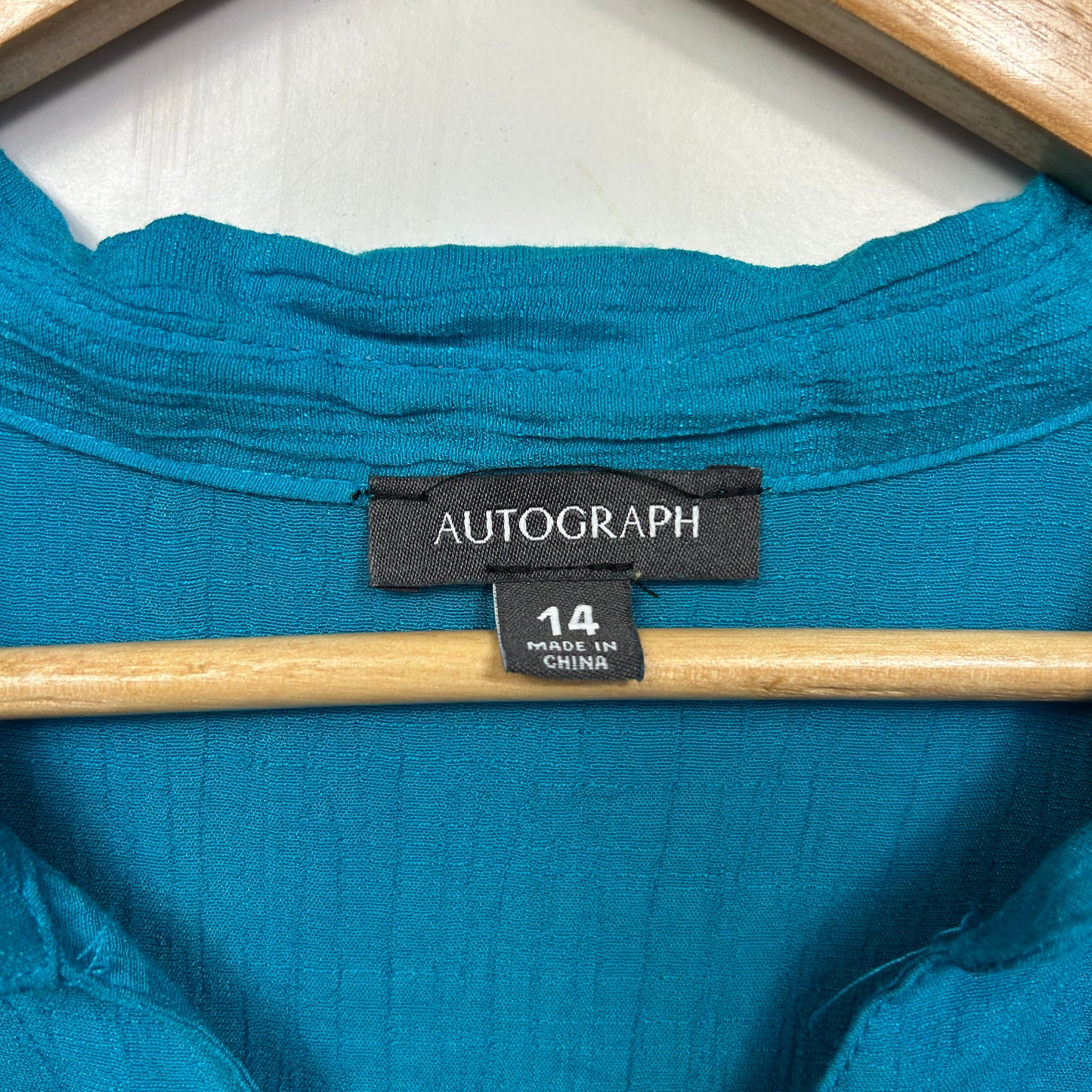 Blue long sleeve top label view