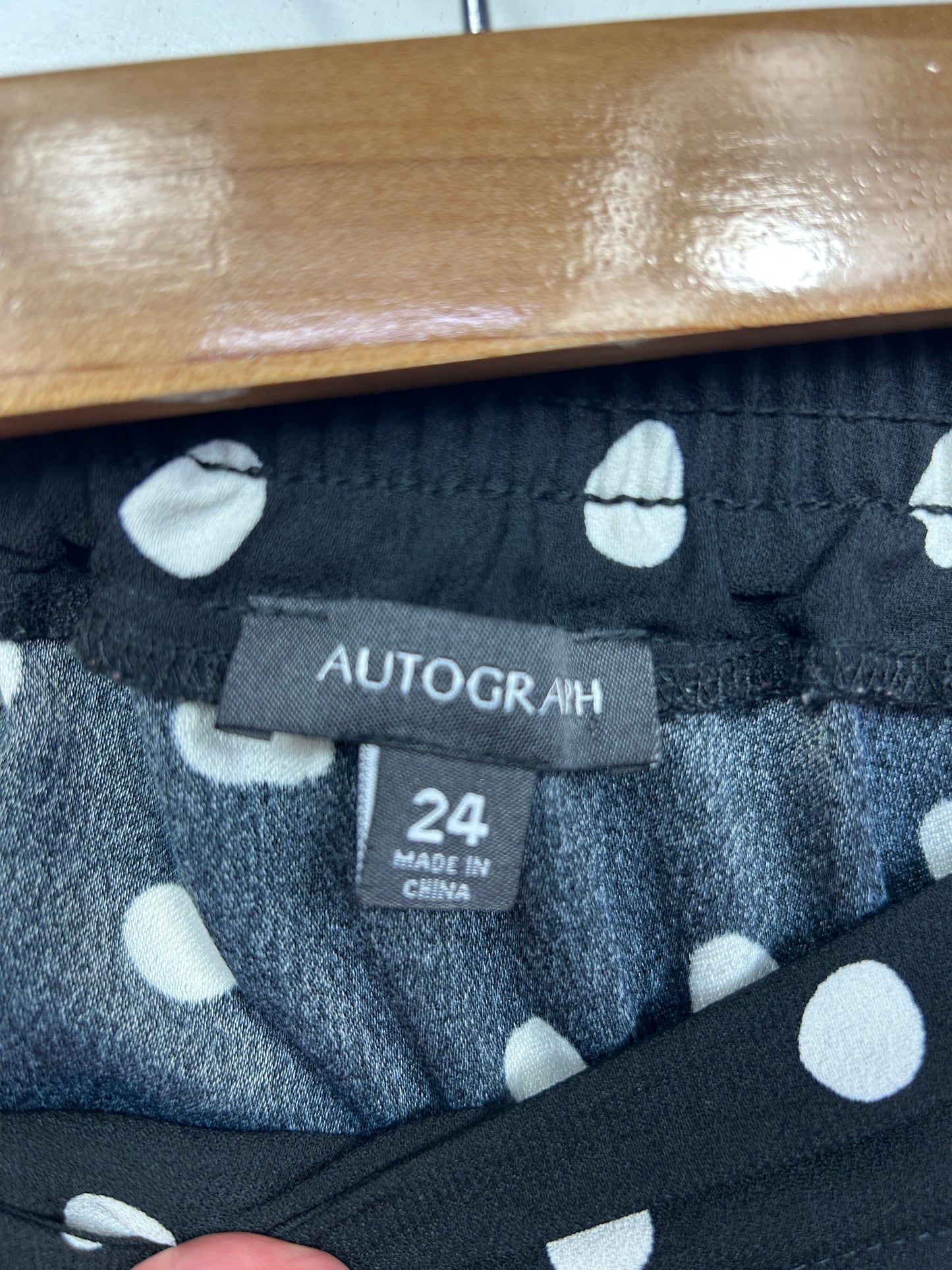 Black and white polka dot leggings detail view