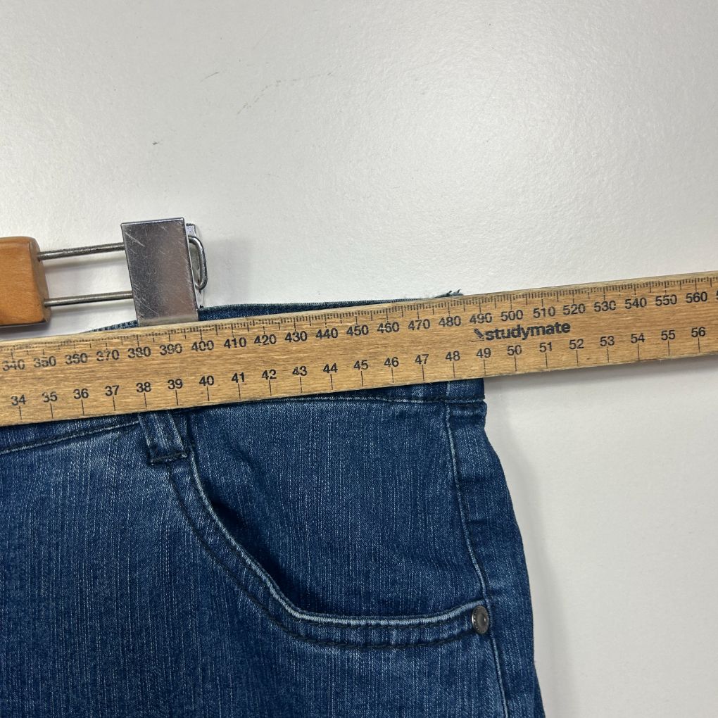 Blue jeans front view with measuring tape