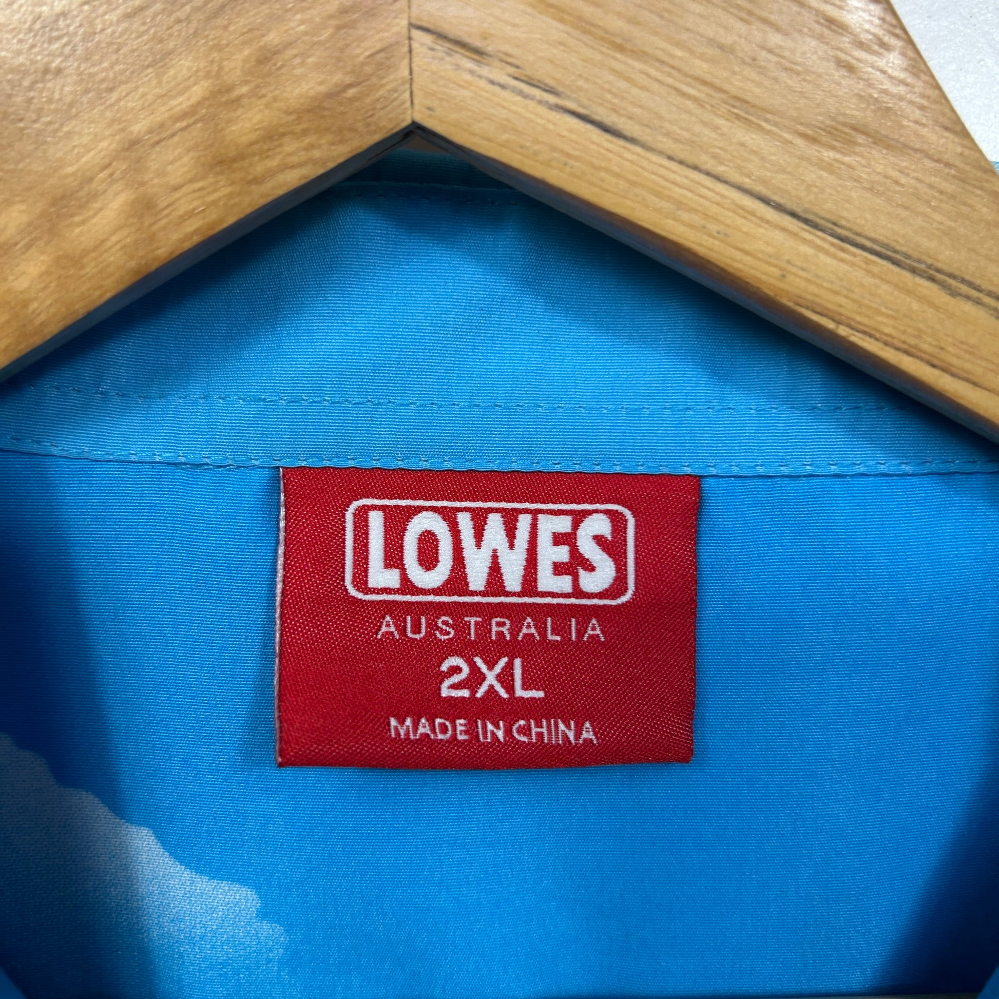 Blue jacket label detail showing Lowes Australia 2XL