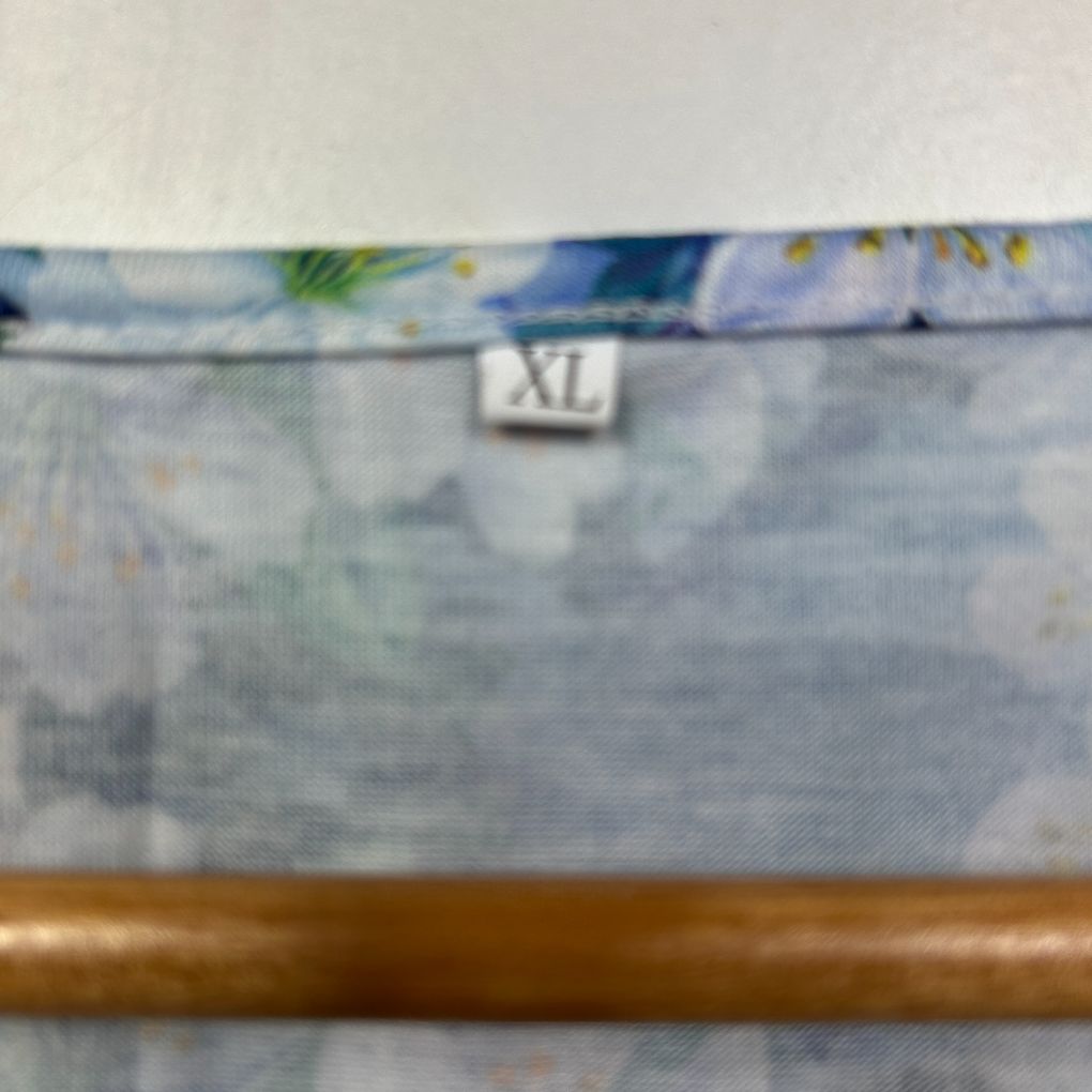 Blue floral top detail view with XL size label