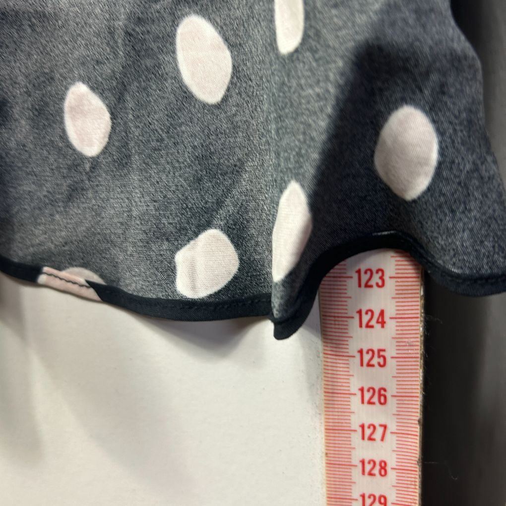 Grey polka dot sweater front view with measurement scale