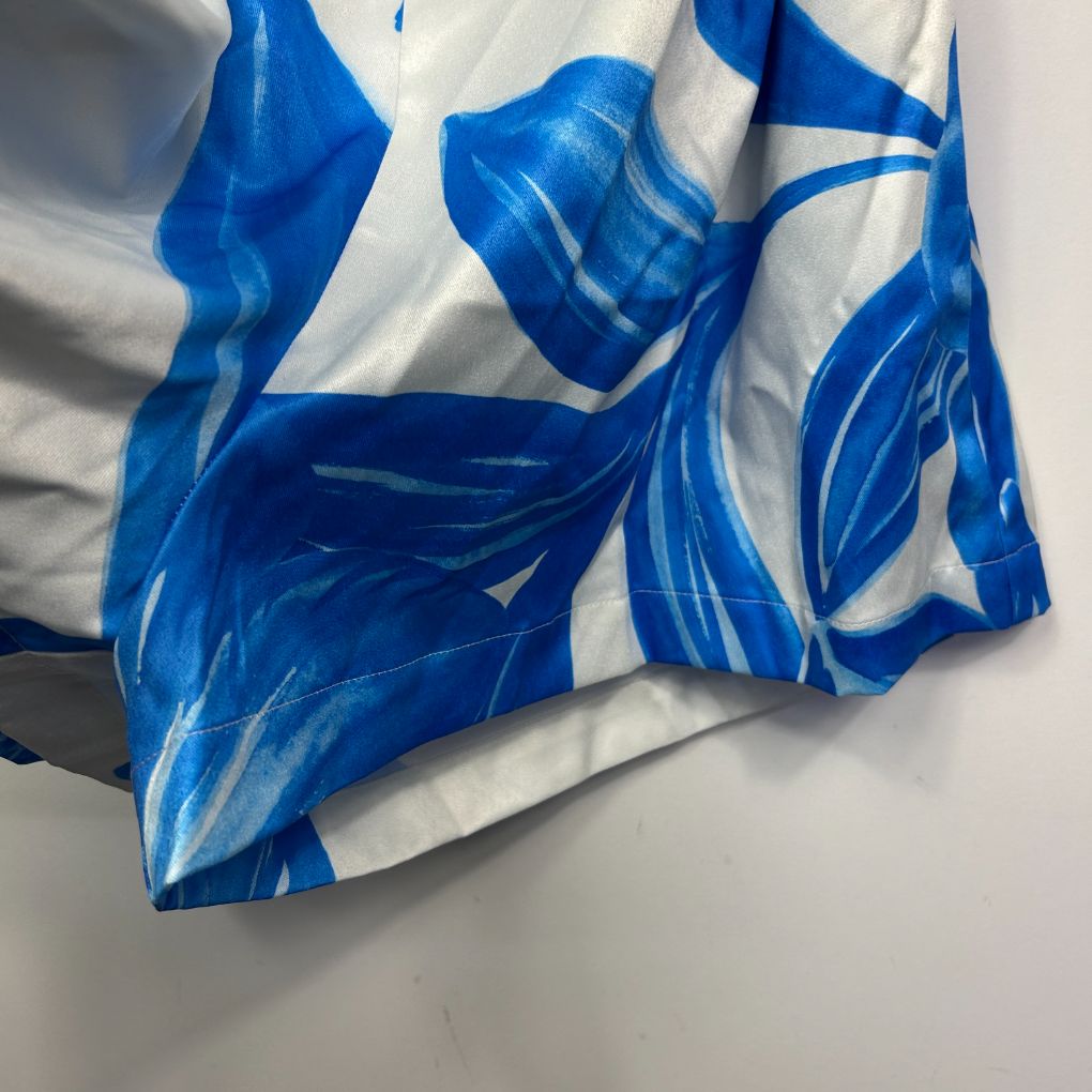 Blue and white graphic print top detail view