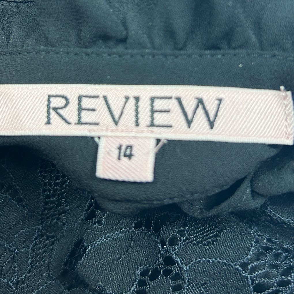 Navy blue garment label detail view