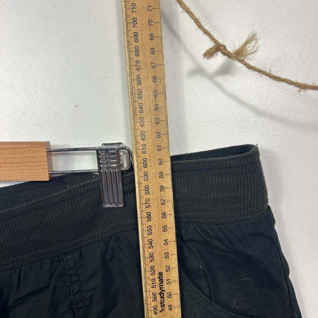 Black shorts front view with measuring tape
