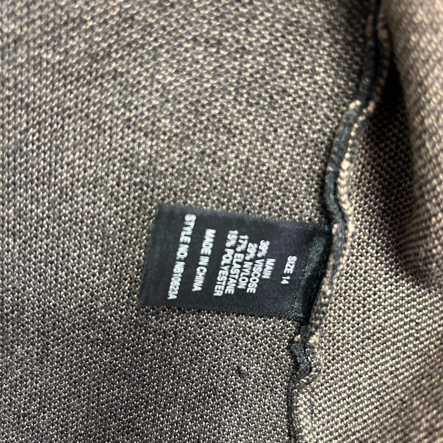 Grey knit garment label detail view