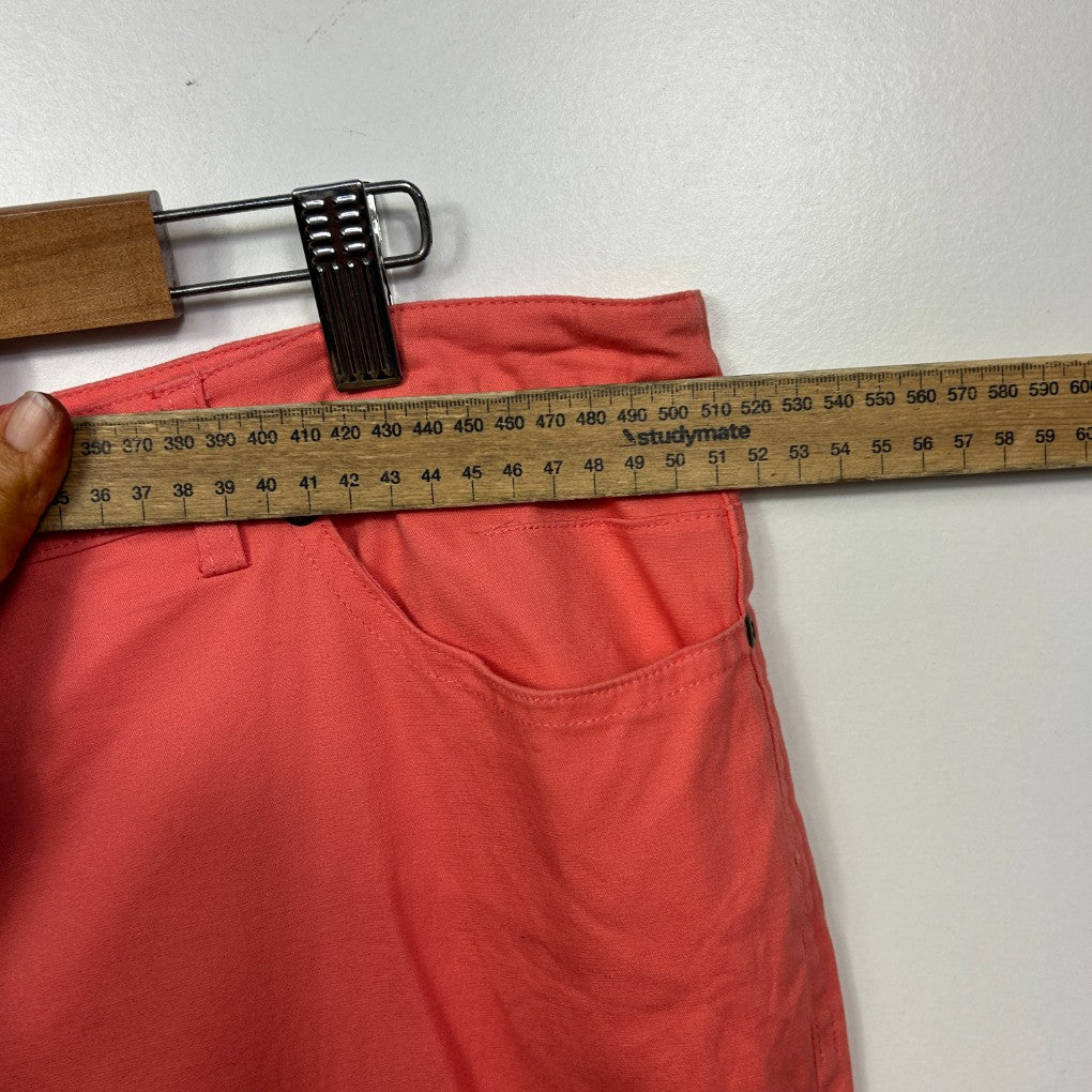 Red pants front view with measuring tape