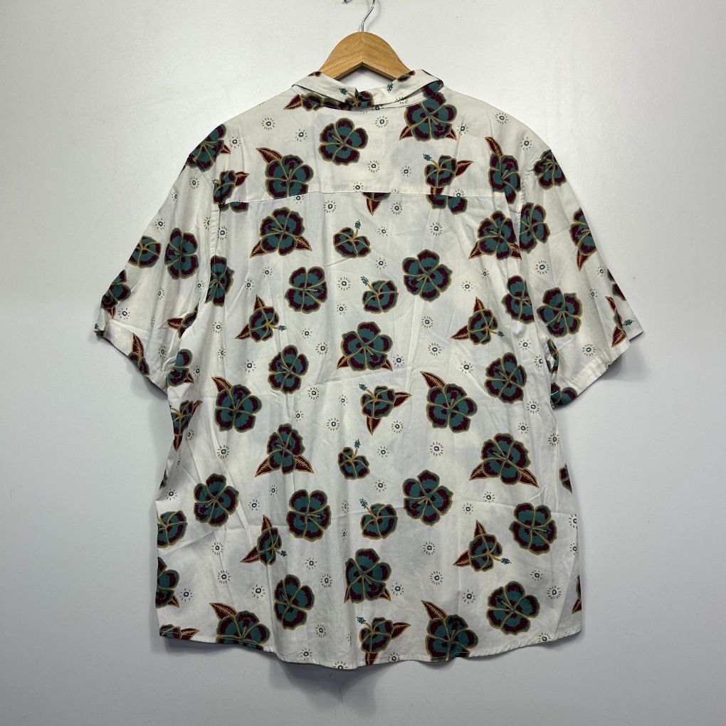 Cream shirt with black floral print front view